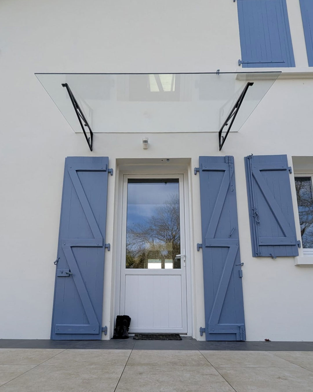 Marquise avec armature en fer forgé conservée – vitrage sur mesure