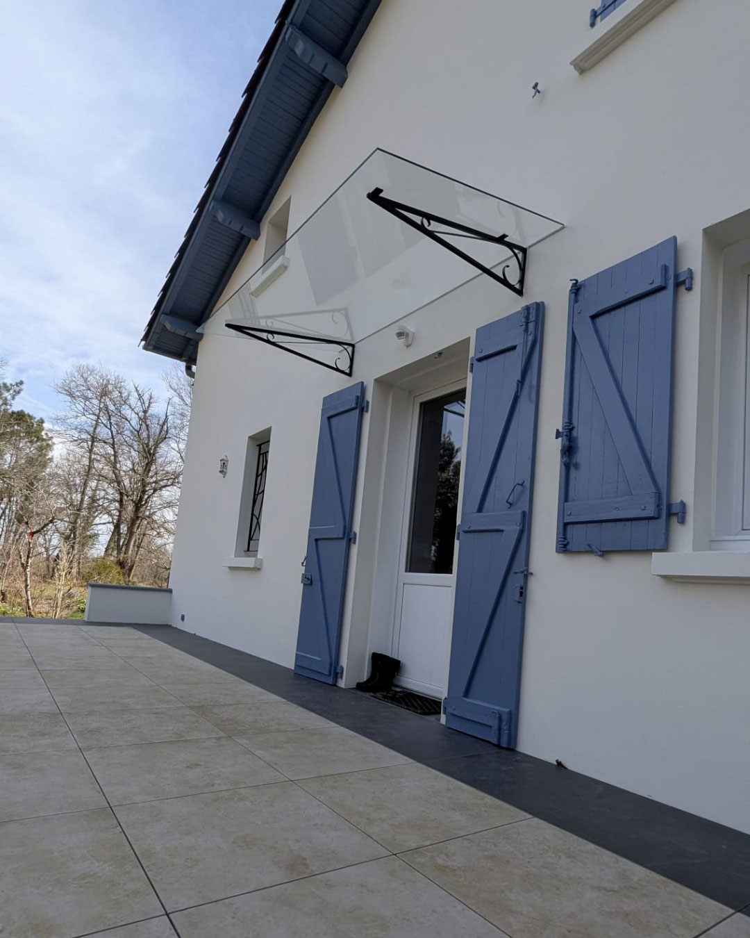 Marquise avec armature en fer forgé conservée – vitrage sur mesure